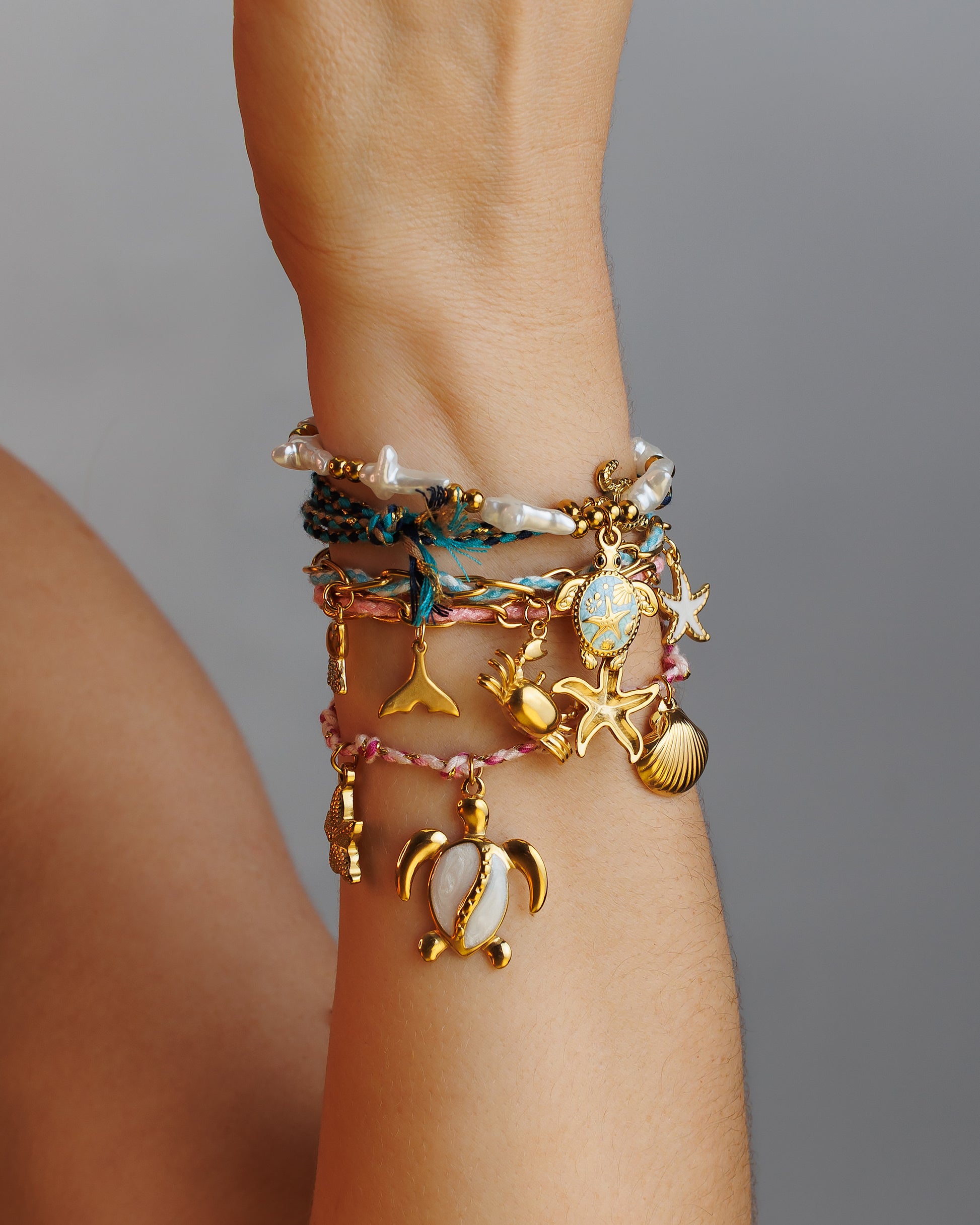 Pulse de Hilo con eslabones, cangrejo, estrella de mar y jelly fish