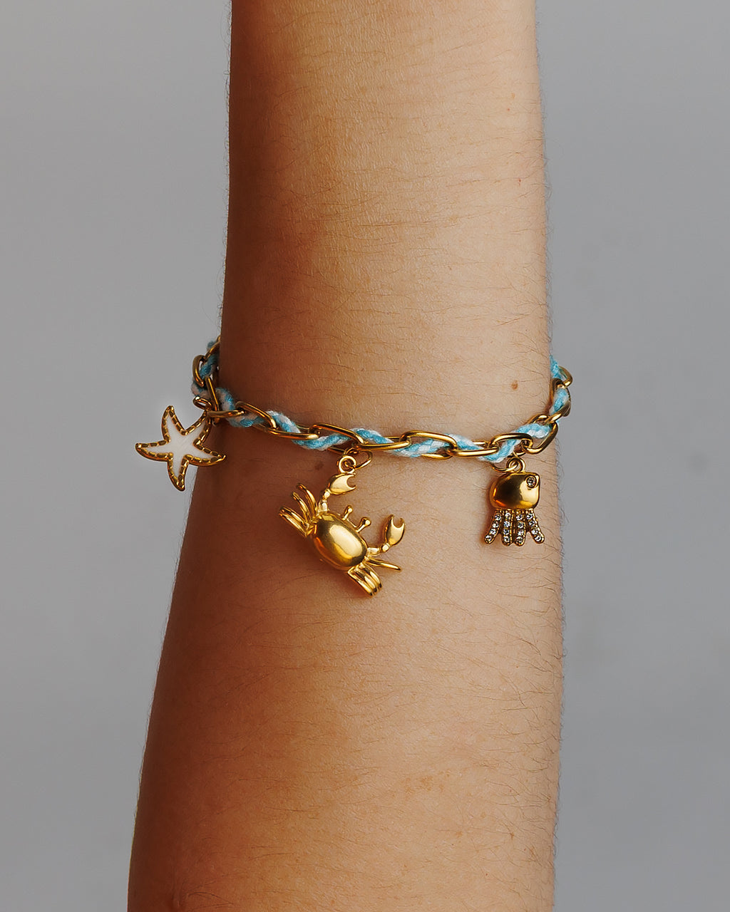 Pulse de Hilo con eslabones, cangrejo, estrella de mar y jelly fish