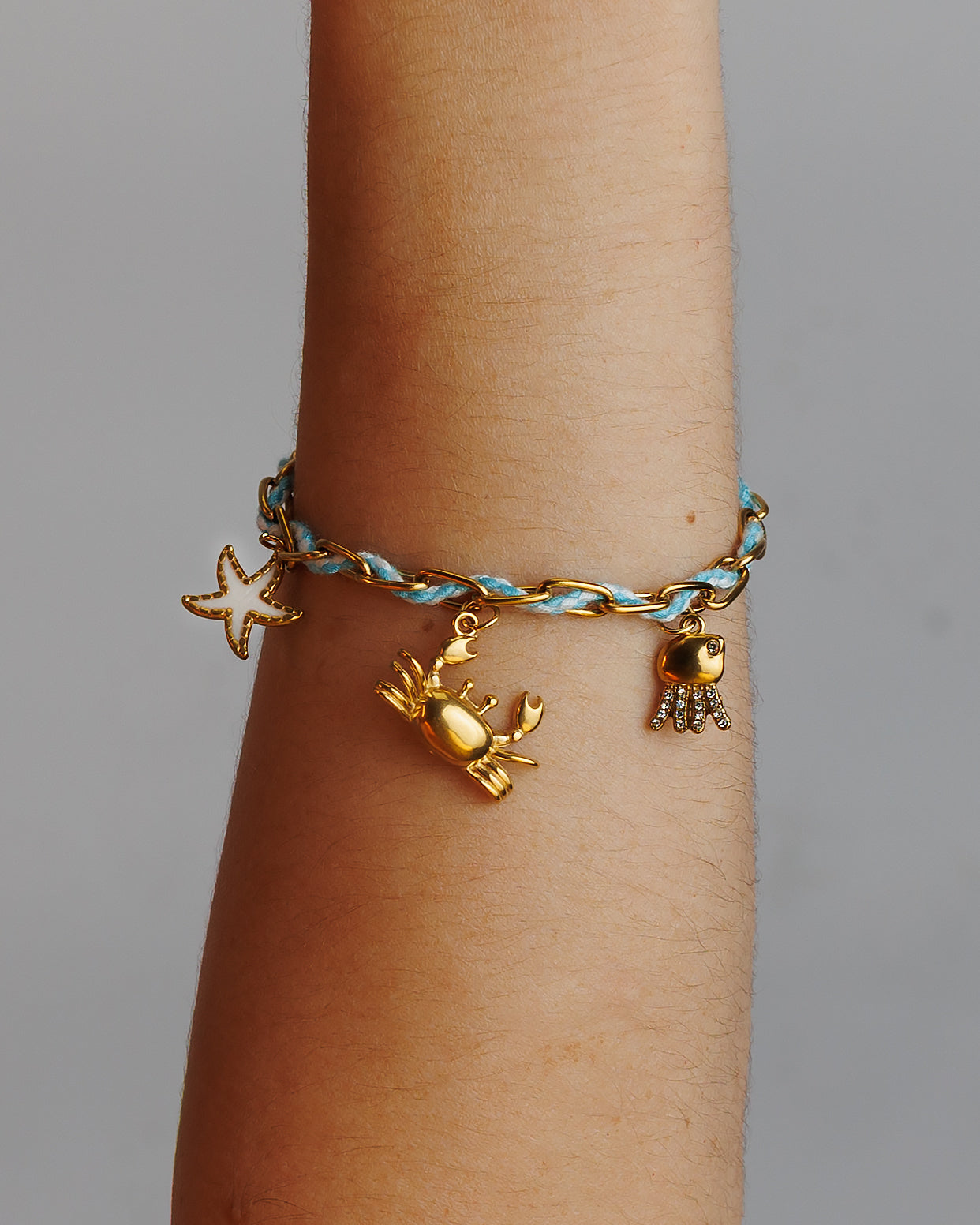 Pulse de Hilo con eslabones, cangrejo, estrella de mar y jelly fish