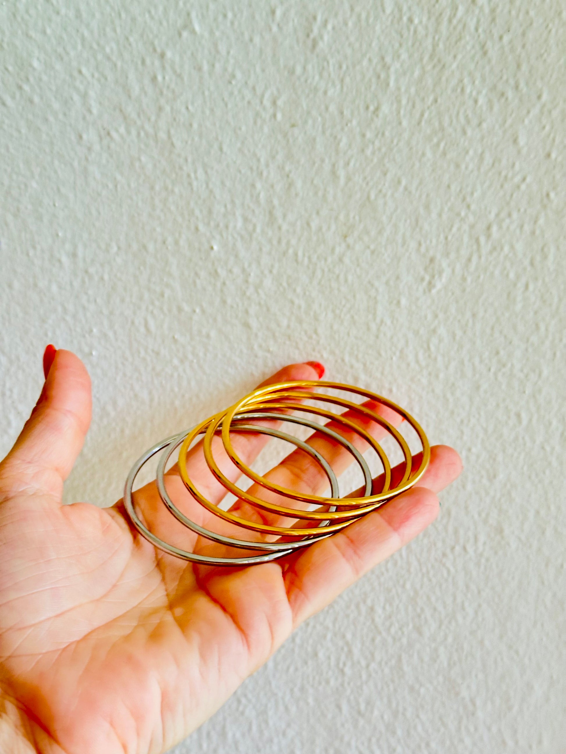 Pulseras bangles plata y dorada