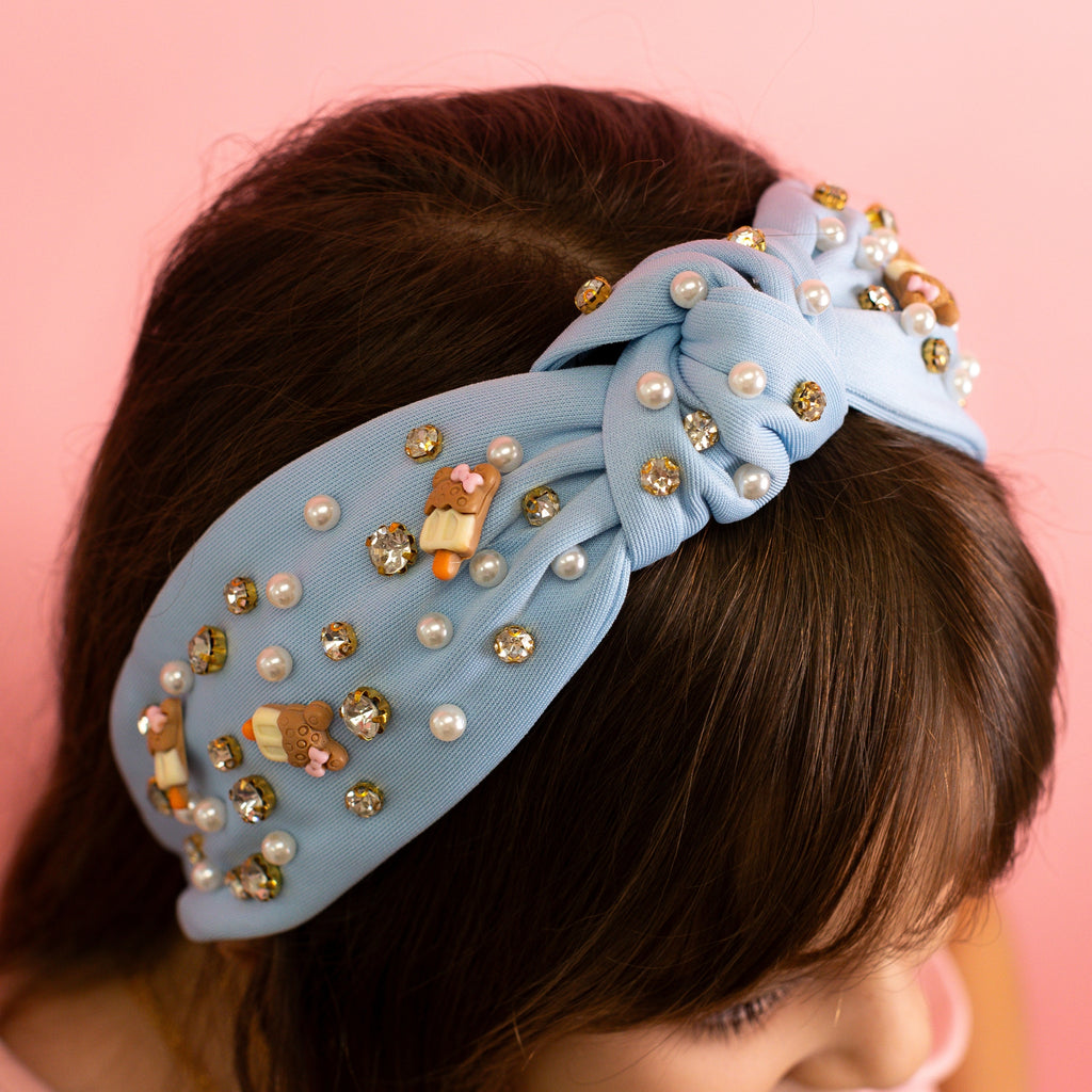 Diadema de perlas y paletas